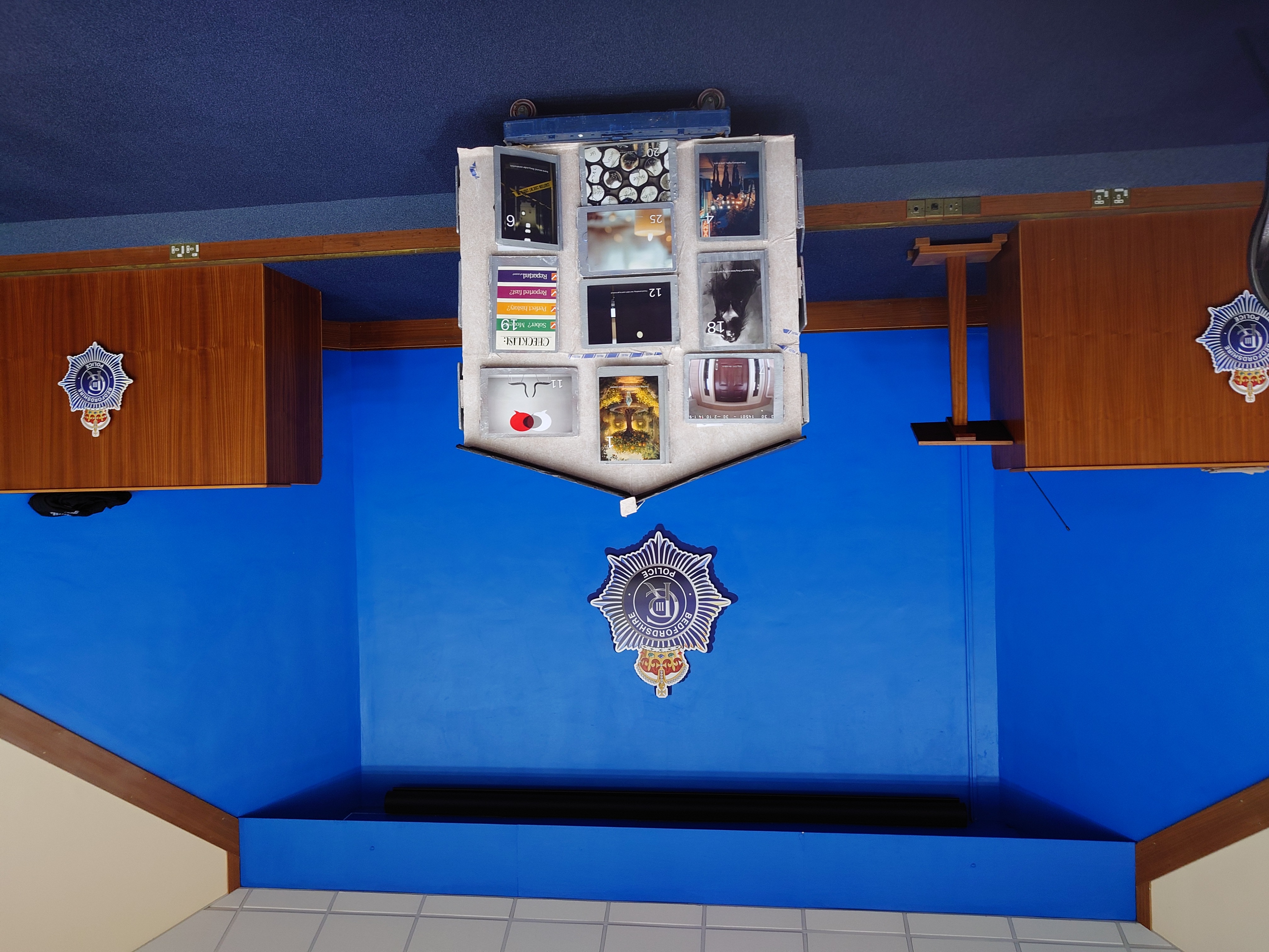 Our House installation at Bedfordshire Police Headquarters with speaker at lectern