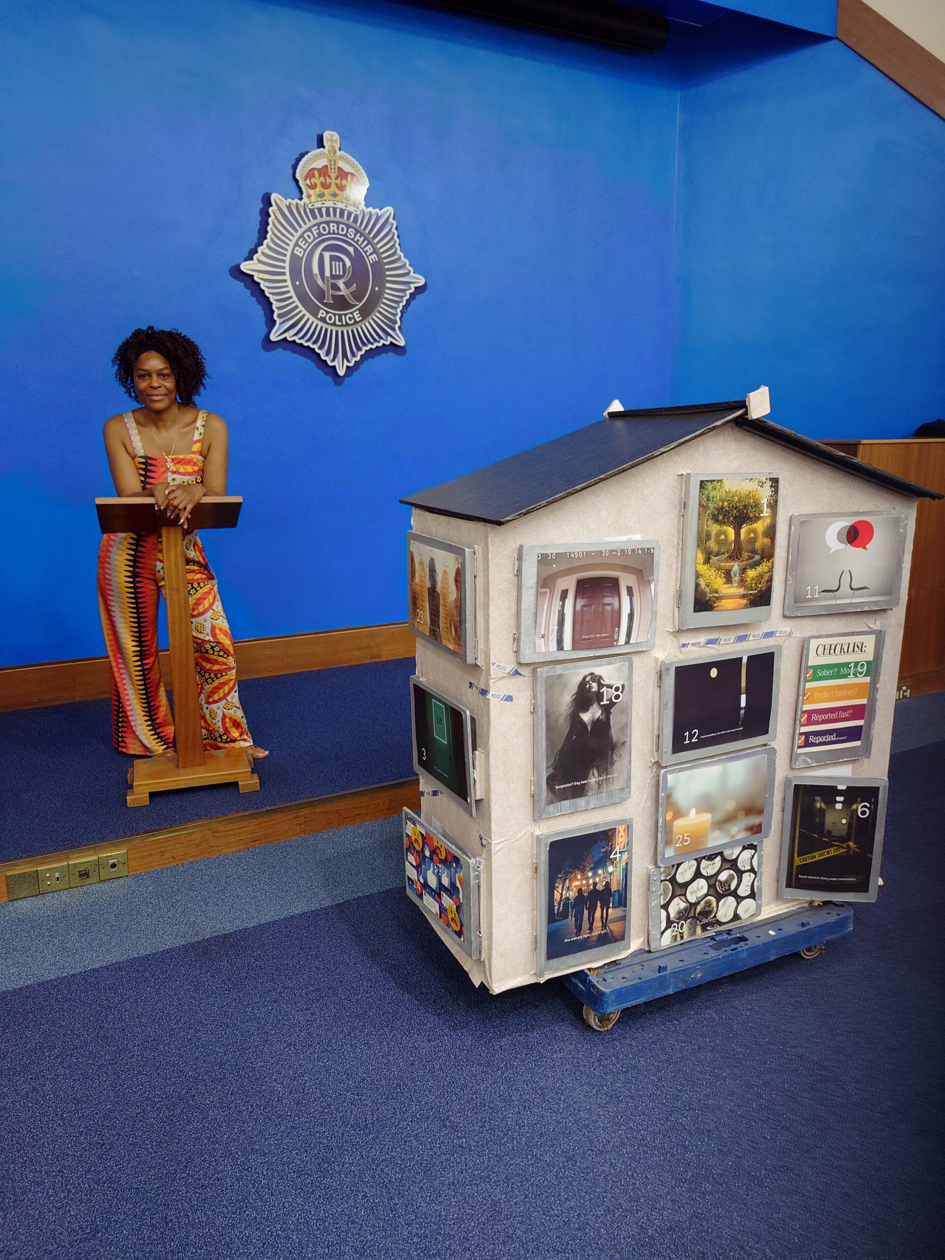 Our House: Who Killed Eve? by Naz Knight, showing the front of a three-dimensional advent calendar house installation